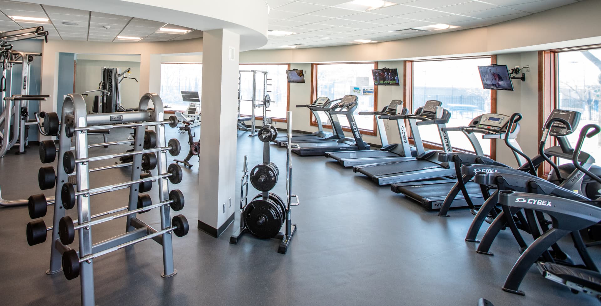 Champions Run Fitness Center with strength equipment, treadmills, and cardio machines